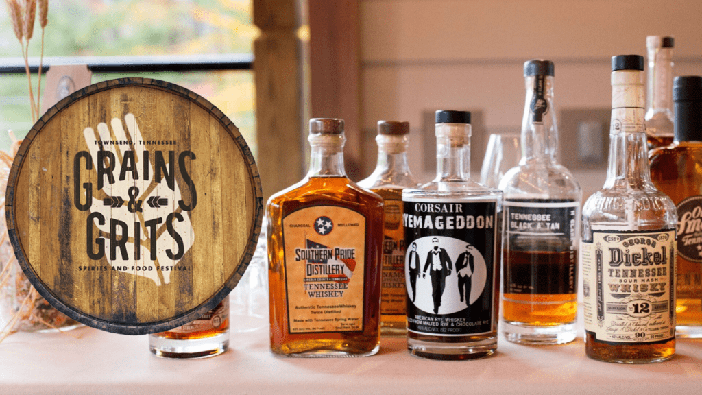 Photo of table with whisky bottles and the Grains and Grits logo on the left