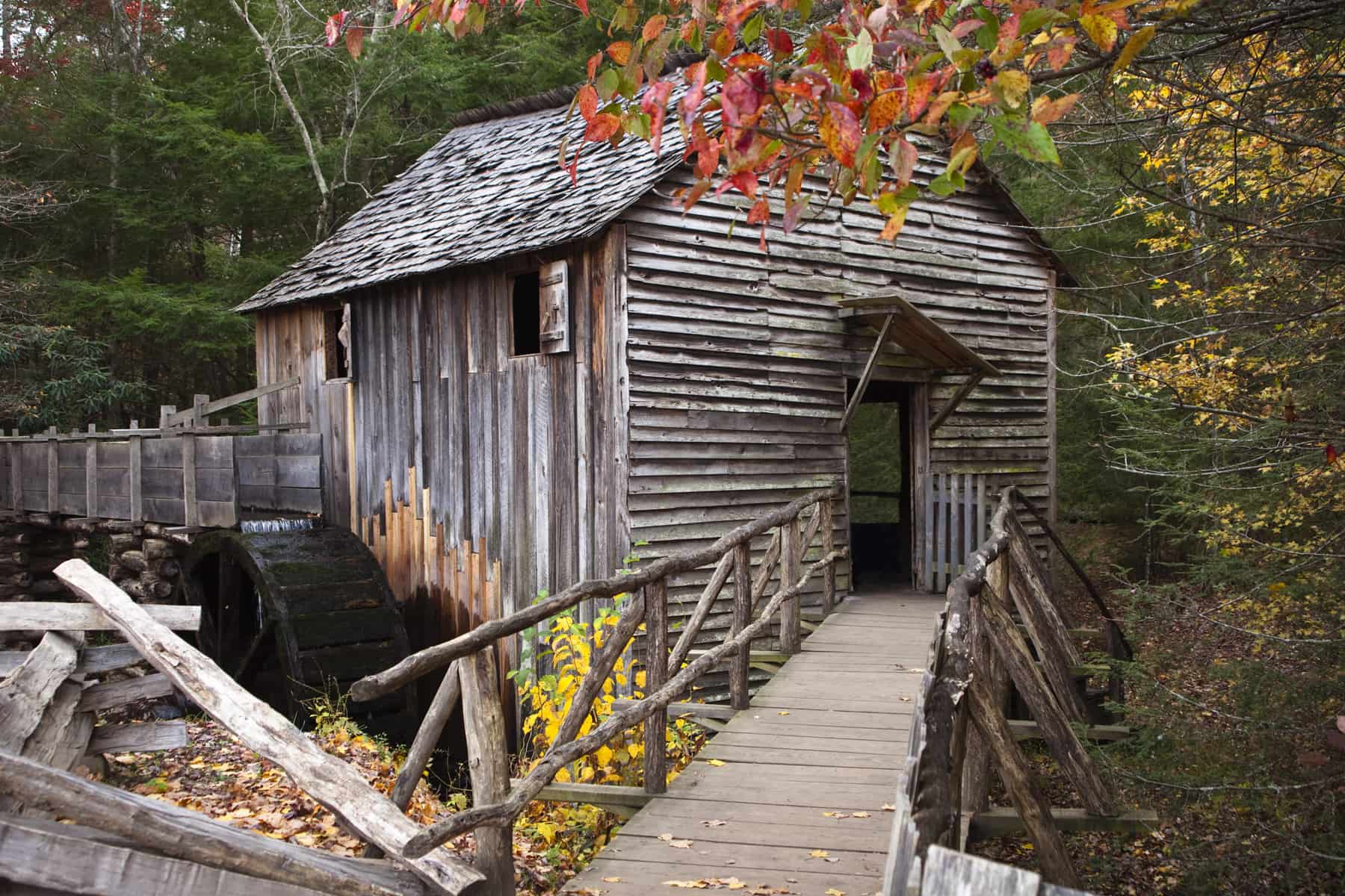 Smoky Mountain barn with bridge during fall leaf peeping season