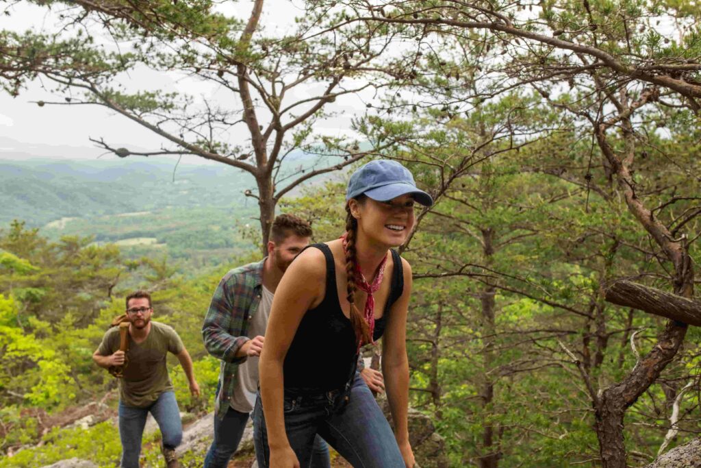group hiking to a waterfall in the smokies